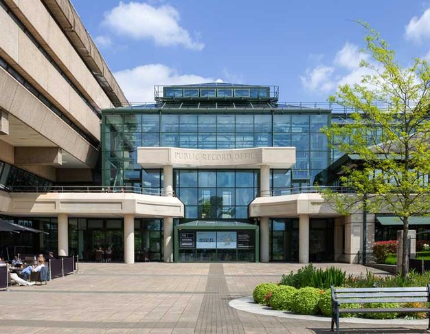 The National Archives' building, a giant brutalist structure next to a glass atrium.